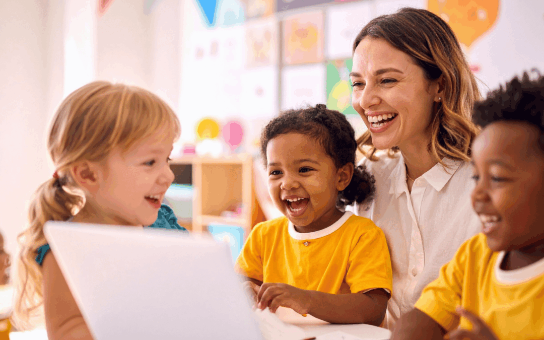 Nurturing preschoolers language development as a cheerful teacher and diverse group of children learn together at a laptop